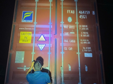 Packing a container of processing machinery for shipment to Tanzania.